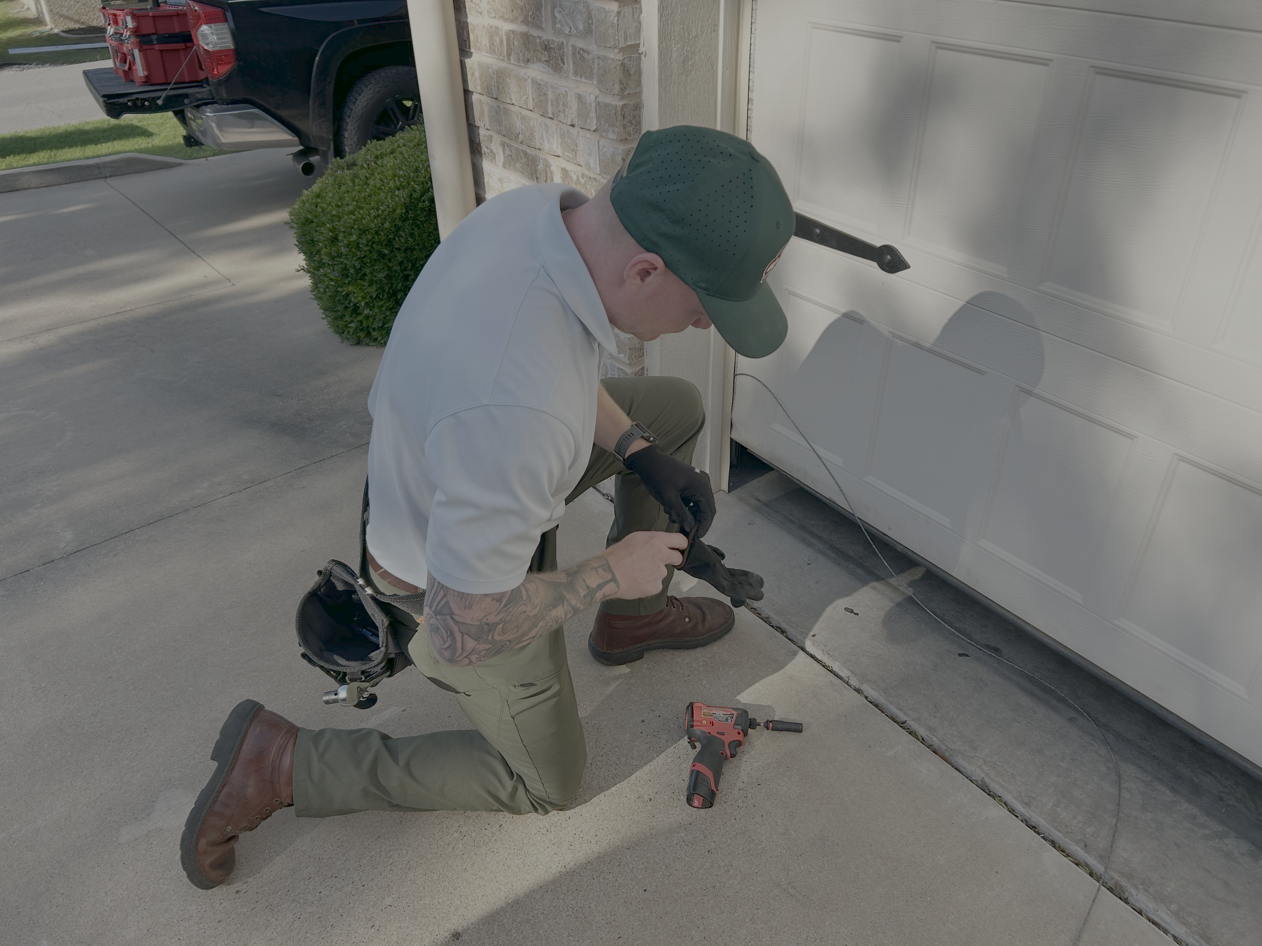 Go Nuts Garage Door technician repairing a garage door in Godley, TX