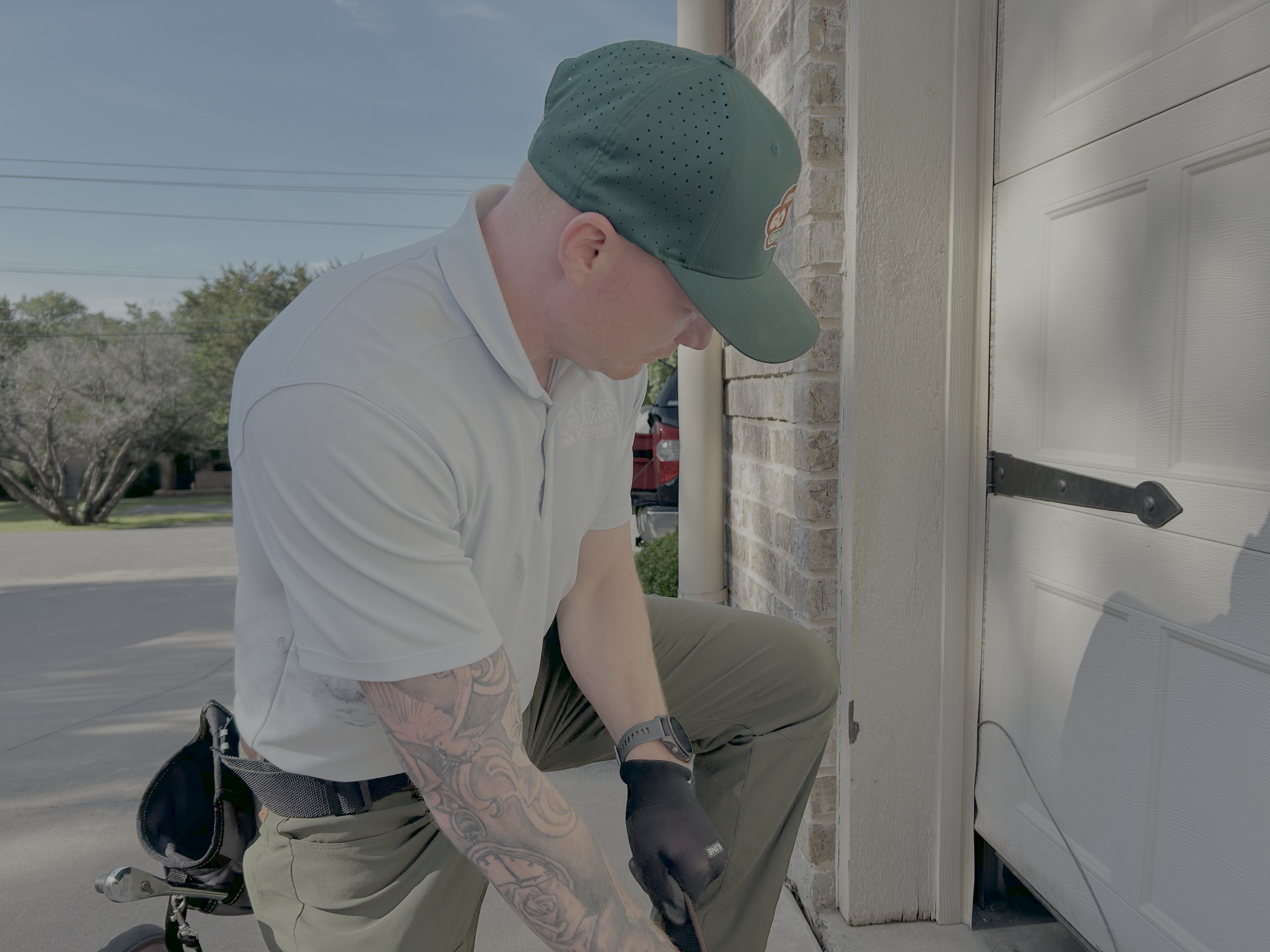 Go Nuts Garage Door technician servicing a garage door in Godley, TX